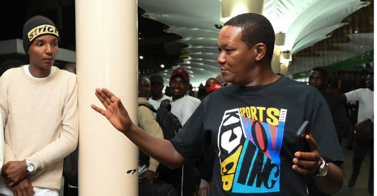 Labour and Social Protection Cabinet Secretary Alfred Mutua seeing off Kenyans at JKIA