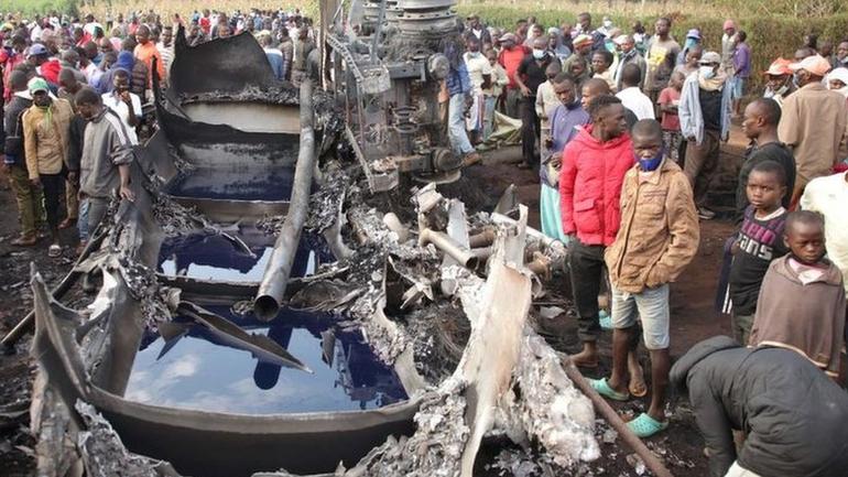 Onlookers view the wreckage and destruction after a fuel tanker exploded on a highway in Kenya, killing 13 (Image: Files)