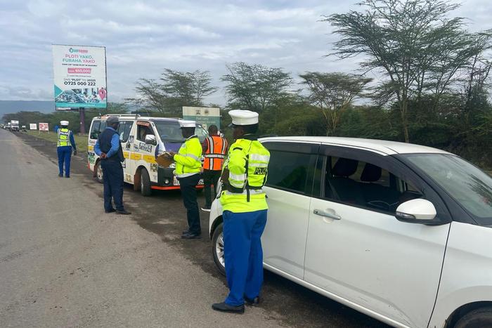 NTSA officers during a crackdown at Salgaa along Nakuru -Eldoret highway.