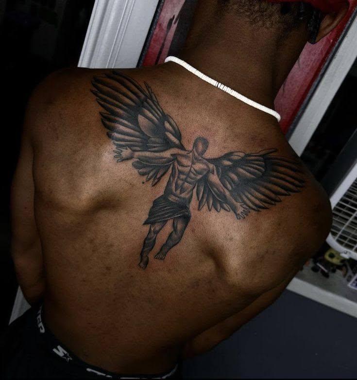 A male model displays an elaborate back tattoo at a Nairobi art exhibition (Image: Files)