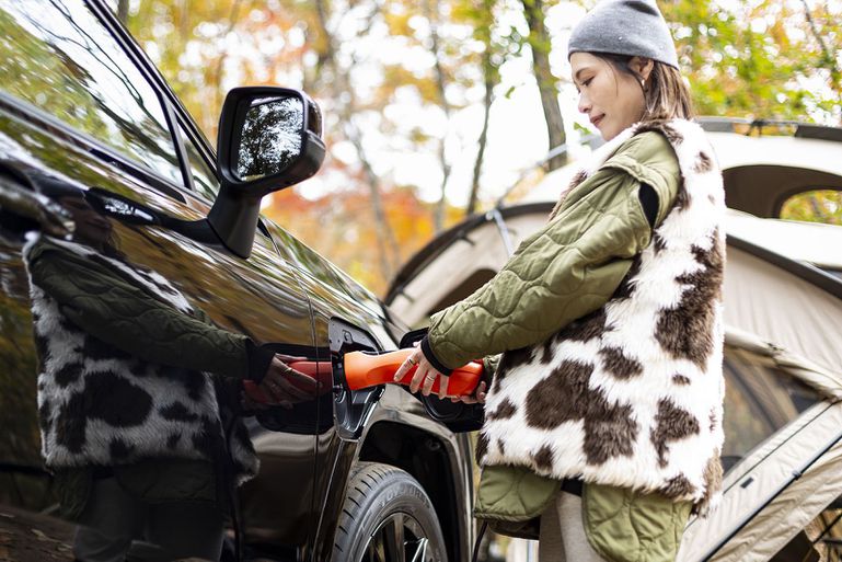 The 2026 Toyota RAV4 Plug-in Hybrid EV's external connector in use