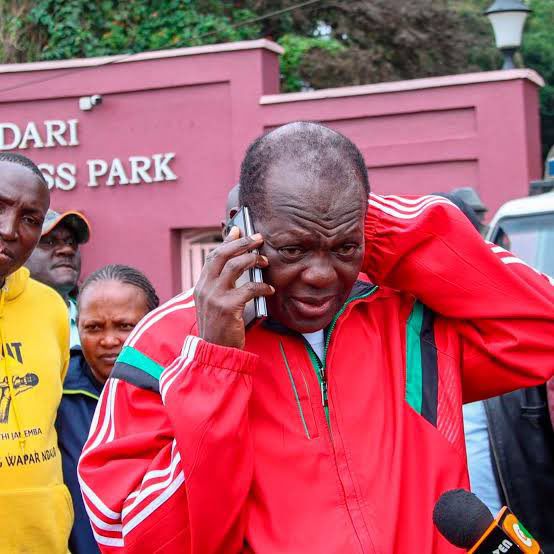 Raphael Tuju makes a phone call on March 14, 2026 after officers raided his property