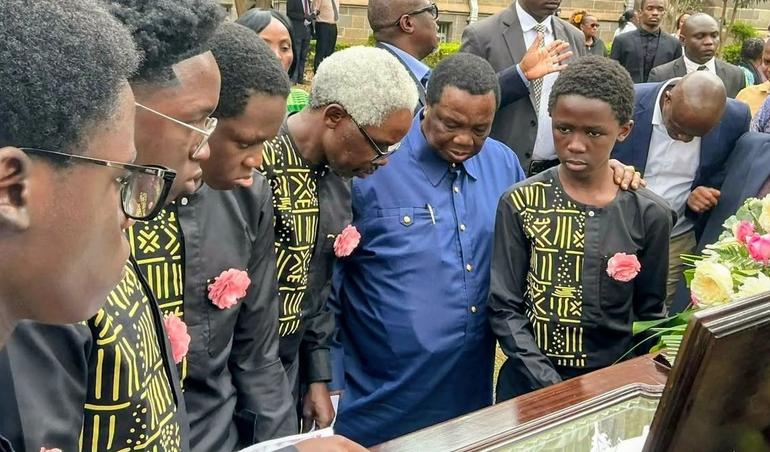 COTU Secretary General with his son Prof. Lukoye Atwoli and grandsons during the funeral ceremony of Maureen Nyadida,.