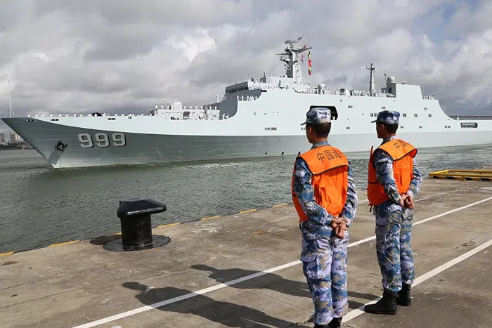 Chinese sailors watch a People’s Liberation Army Navy (PLAN) pull into Djibouti. Xinhua Photo
