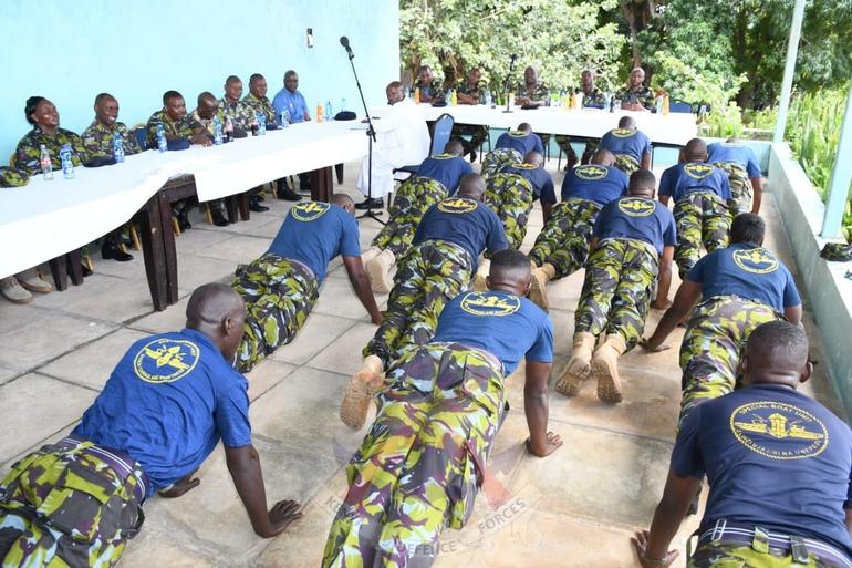 Fresh graduands of the elite SBU team celebrate victory with push ups at a recent pass out ceremony (Image: Facebook)