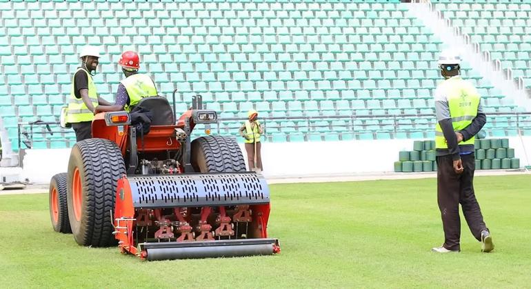 Stitching synthetic fibres into the grass at Talanta Sports City.