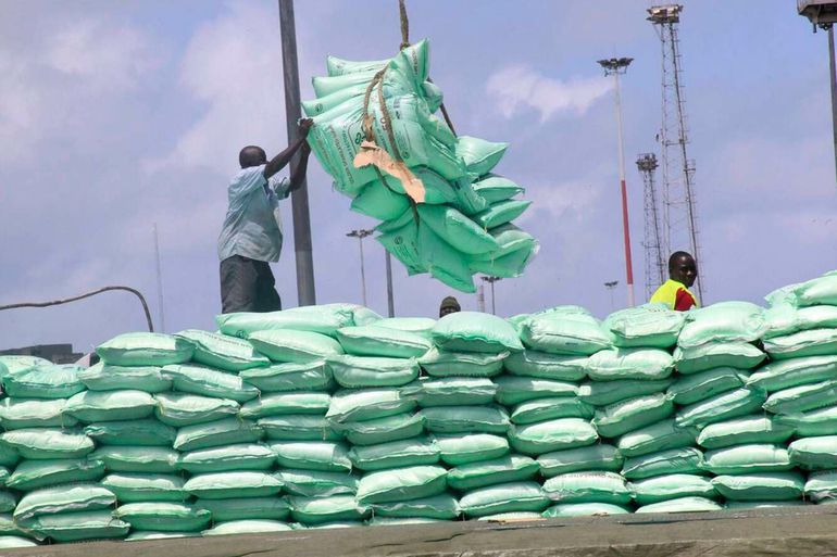Dockworkers off-loading sugar at the port of Mombasa