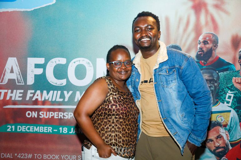 Damaris Nyawira of Multichoice Group Holdings (MGH) poses for a photo with Austin Muigai a content producer during the AFCON launch and watch party held at The Tunnel.