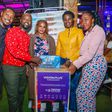 Dickson Muchiri, Elisha Kamau, from Multichoice Kenya present winner Elizabeth Musyoki with a Vision Plus Tower Bluetooth speaker together with Leila Shikuku and Christine Gichimu from Vision Plus
