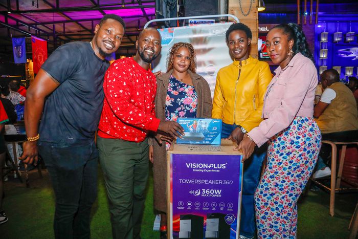 Dickson Muchiri, Elisha Kamau, from Multichoice Kenya present winner Elizabeth Musyoki with a Vision Plus Tower Bluetooth speaker together with Leila Shikuku and Christine Gichimu from Vision Plus