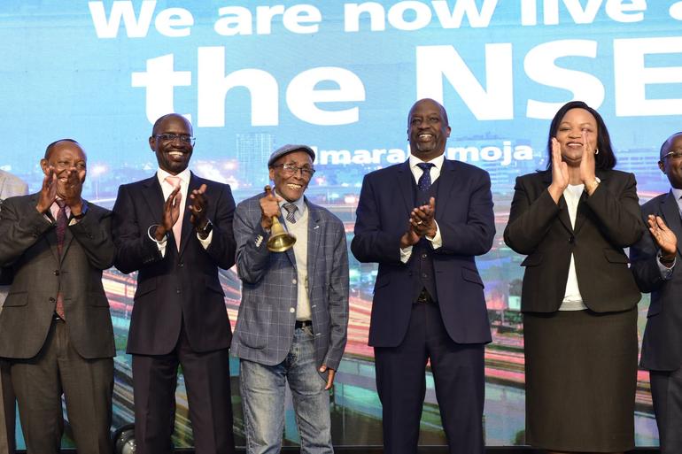 Family Bank founder Titus Kiondo Muya and other officials at the Nairobi Securities Exchange (NSE) for Family Bank's historic listing