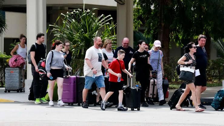 European tourists wheel their luggage to the taxi bay after clearing the international arrivals gate at JKIA (Image: Files)
