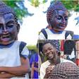 Unemployed Nairobi man behind huge Buddha head, gigantic shoes reveals face