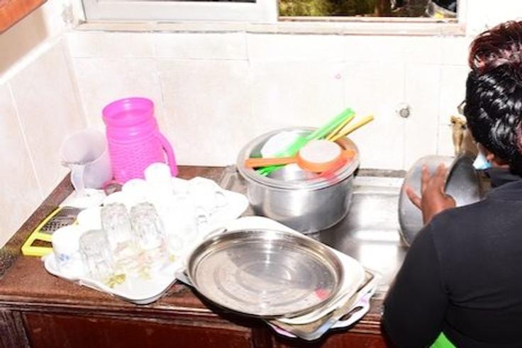 A woman washing dishes