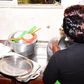 A woman washing dishes