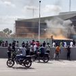 Protesters set fire to the gate of the Belgian embassy in Kinshasa on Tuesday
