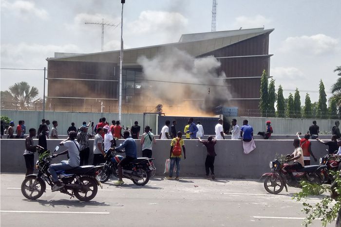 Protesters set fire to the gate of the Belgian embassy in Kinshasa on Tuesday