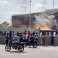 Protesters set fire to the gate of the Belgian embassy in Kinshasa on Tuesday