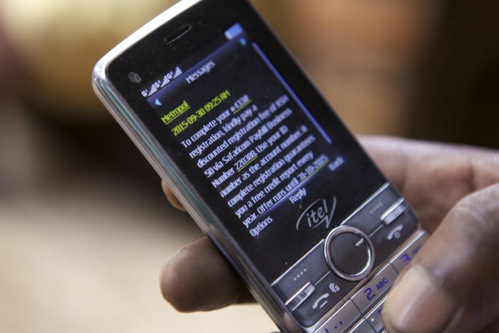 A person using their phone to  transact