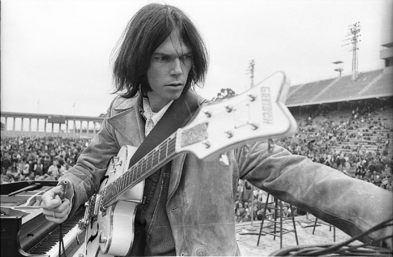 Neil Young during a sound check at Balboa Stadium, 1969. Photo by Henry Diltz.