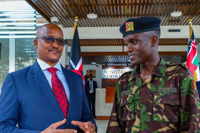 Chief of the Defence Forces (CDF) General Charles Kahariri with Corporal Boniface Muchiri
