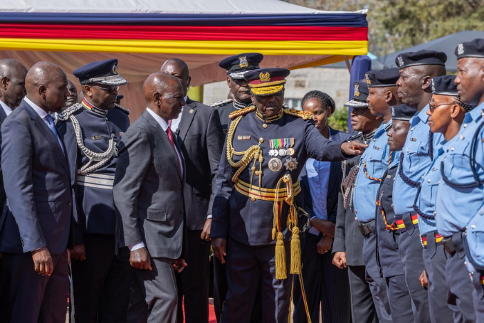 President Ruto admires the new police uniform during the pass-out parade for recruits in Kiganjo, Nyeri County. (Image: PCS)