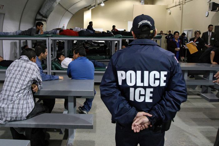 A group of undocumented immigrants awaiting deportation.