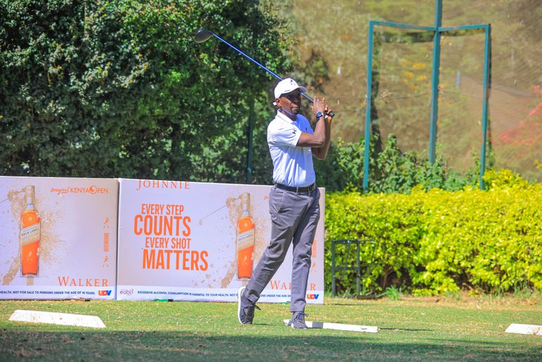 EABL General Manager, Spirits, Alvin Mbugua follows his shot during the Johnnie Walker sponsorship for Magical Kenya Open announcement