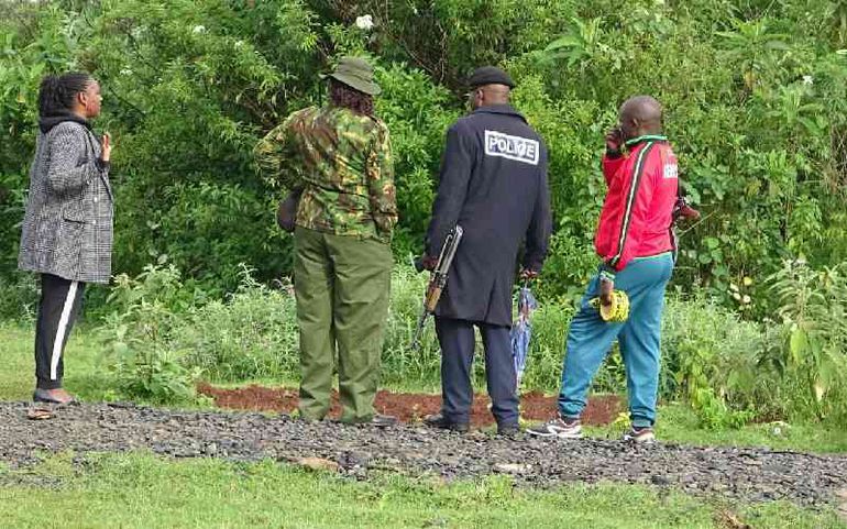 Police officers conduct investigations at Makaburini Cemetery in Kericho