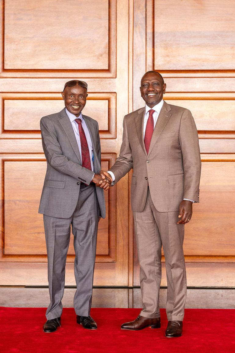 Past image of former Ol Kalou MP, the late David Njuguna Kiaraho, with President William Ruto