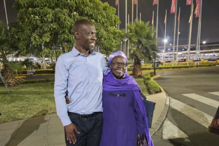 Stephen Munyakho embraced by his mother at the Jomo Kenyatta International Airport when he arrived from Saudi Arabia