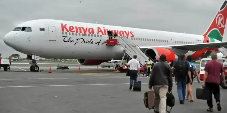 A file image of passengers boarding a Kenya Airways plane