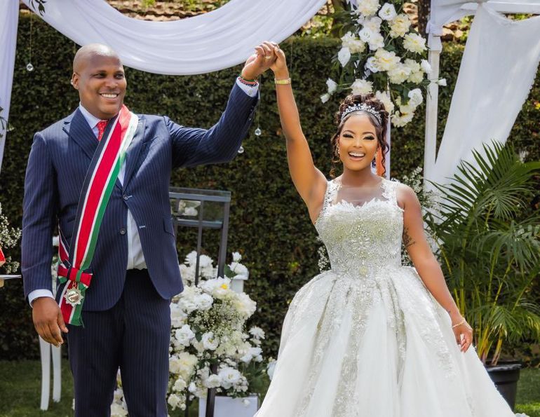 Jomo Gecaga and  Lola Hannigan during their wedding