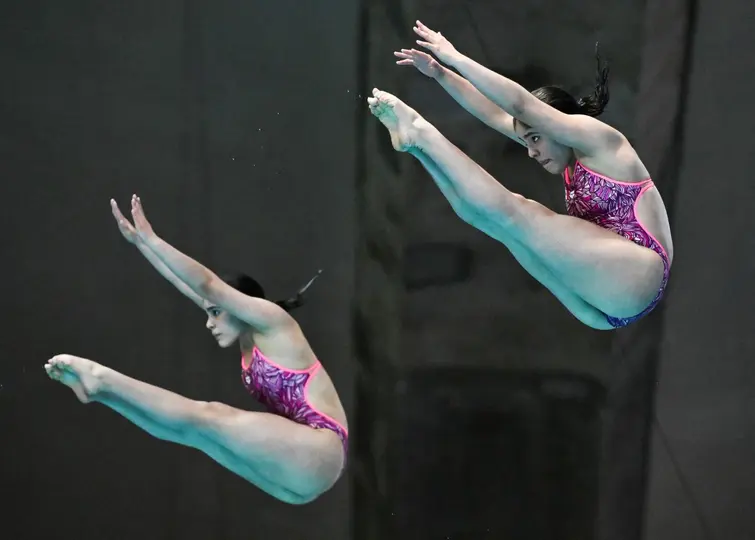 Mia y Lia Cueva durante la Copa Mundial de Clavados | AFP