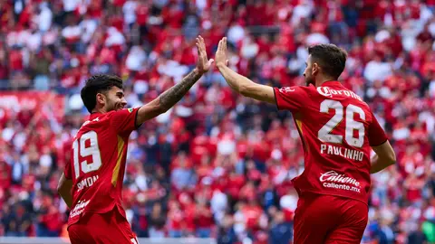 Paulinho en festejo con Santiago Simón | MEXSPORT