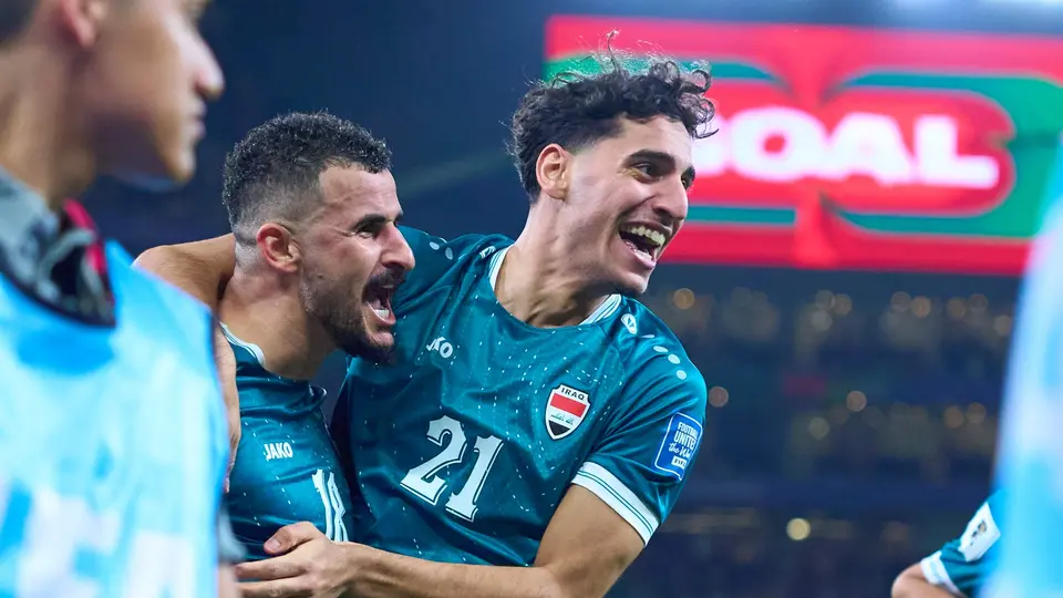 Marko Farji celebra con Aymen Hussein en el partido entre Iraq y Bolivia | MEXSPORT