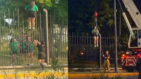 Aficionada queda atorada en una reja de cuatro metros tras intentar entrar al Fan Fest de Monterrey