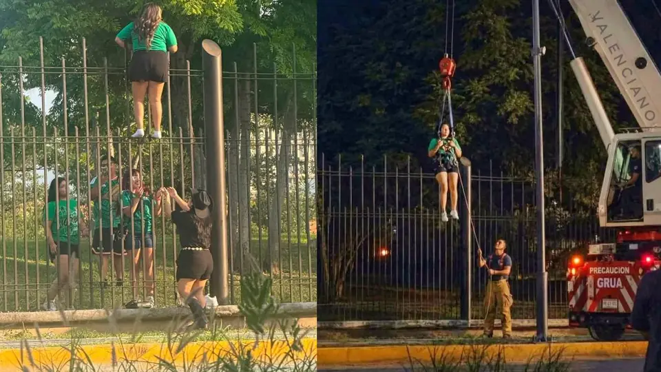Aficionada queda atorada en una reja de cuatro metros tras intentar entrar al Fan Fest de Monterrey