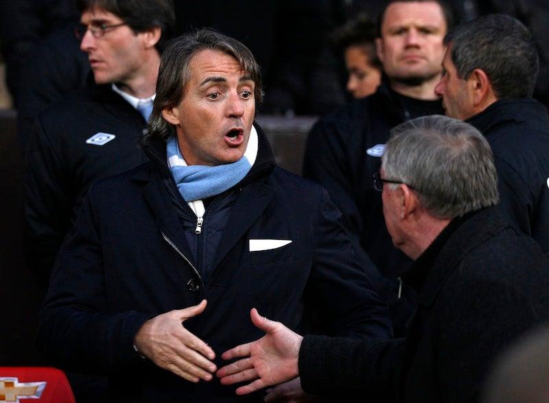 Roberto Mancini saluda a Sir Alex Ferguson | AP