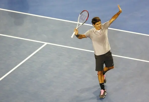Federer vence a Tomic y suma 250 triunfos en Grand Slam