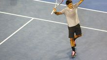 Federer vence a Tomic y suma 250 triunfos en Grand Slam