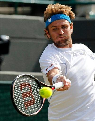Fish enfrenta con dificultad a Rafa Nadal. FOTO: AP