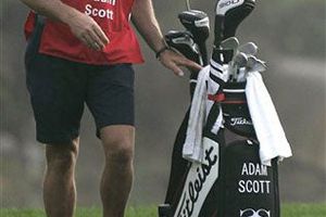 Woods señala que su ex caddie no es racista