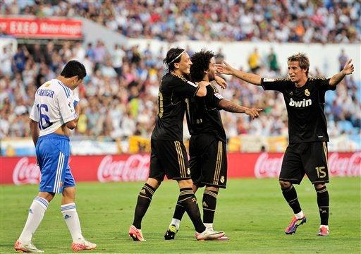 Pablo Barrera se lamenta no poder hacer nada para detener el vendaval merengue.  FOTO: AP