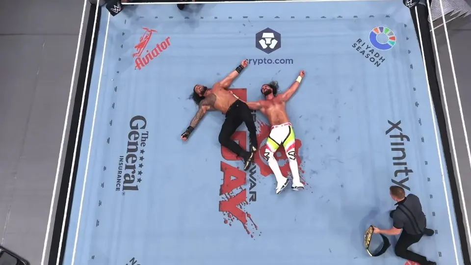 Reigns y Rollins tendidos en medio de la lucha | Captura de pantalla