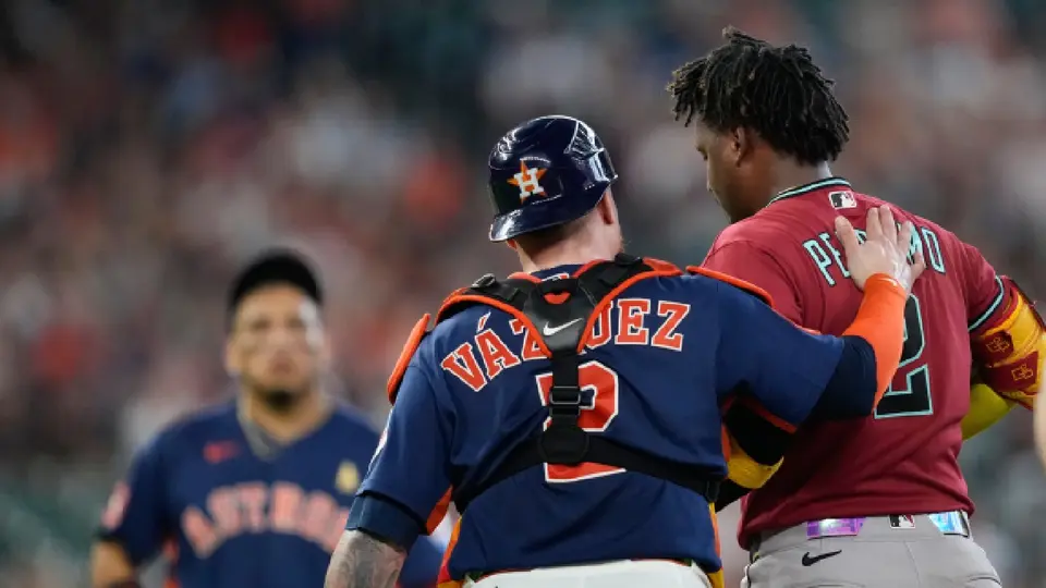 Geraldo Perdomo y el catcher Christian Vázquez | AP