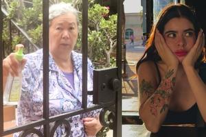 VIDEO: Señora rocía con agua bendita a joven por estar “poseída” por sus tatuajes