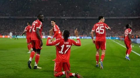 Michael Olis celebrando su gol ante el Real Madrid en Champions League I AP