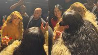 Mariah Carey detiene show para darle un autógrafo a a Rihanna en su pecho
