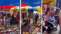 VIDEO: Mujeres ‘perrean’ a policías en pleno tianguis; la autoridad se hace de la vista gorda